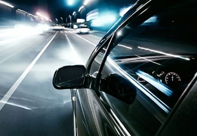 Car driving quickly into European motorway fast lane Car driving quickly into European motorway fast lane