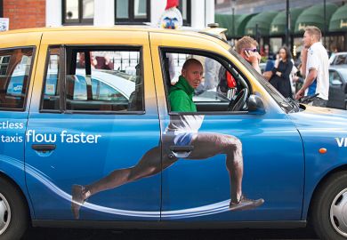 Taxi cab with advertisement on the side that adds body to driver's head, humorously
