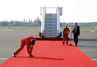 rolling out red carpet at airport