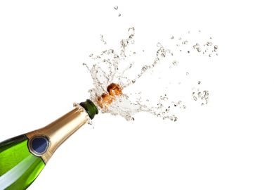 Cork popping on a champagne bottle Cork popping on a champagne bottle