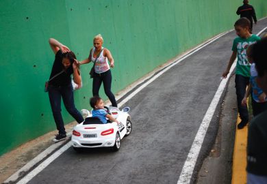 Child drives miniature car into people
