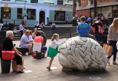 Children climbing on sculpture by-Anne and Patrick Poirier, Norwich, Norfolk