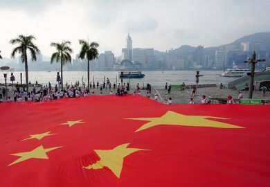 A giant Chinese national flag is displayed at Tsim Sha Tsui to celebrate the 72nd anniversary of the founding of the People’s Republic of China on 1 October 2021 in Hong Kong, China.