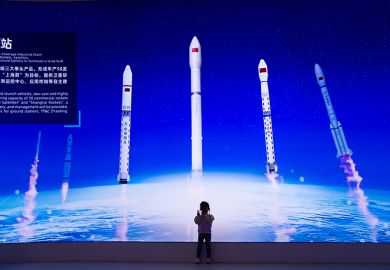 A visitor at the Shanghai Expo Trade Center in Shanghai, China, on 27 April 2025, during China’s Space Day to promote the education of aerospace science and technology for youth in China.