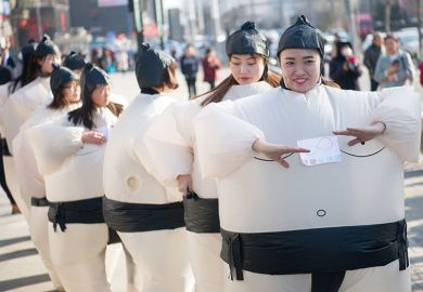 Women dressed in inflatable sumo-wrestler costumes Women dressed in inflatable sumo-wrestler costumes to illustrate Universities ‘partly to blame’ for Chinese graduates’ job woes