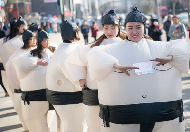 Women dressed in inflatable sumo-wrestler costumes to illustrate Universities ‘partly to blame’ for Chinese graduates’ job woes