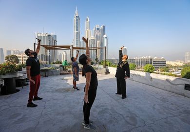 Instructor teaching Chinese martial arts on roof of building in Dubai Instructor teaching Chinese martial arts on roof of building in Dubai