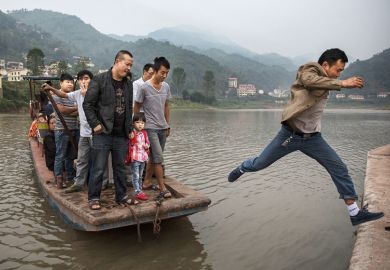 Man leaps from boat, China