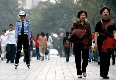 Chinese police officer on rollerblades