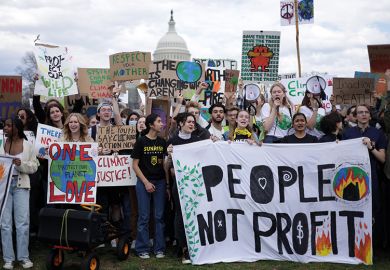 Environmental activists rally on Capitol Hill during a Fridays Global Climate Strike event in March 2022 in Washington, DC.