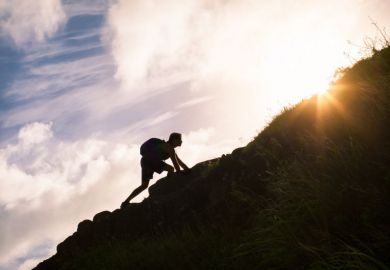 Person climbing a slope
