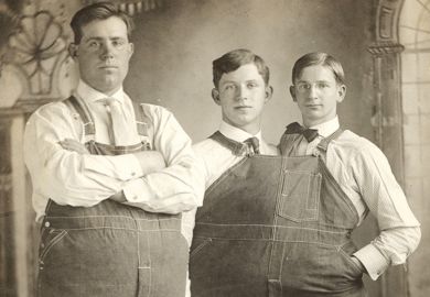 Two men close together wearing same clothes