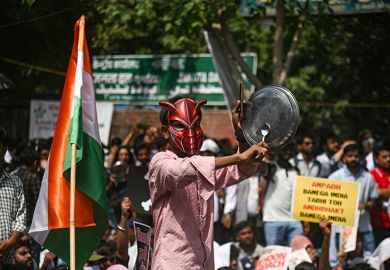 A supporter of the Cockroach Janta Party bangs a plate during a sit-in protest demanding the resignation of Indian education minister Dharmendra Pradhan in New Delhi in June A supporter of the Cockroach Janta Party bangs a plate during a sit-in protest demanding the resignation of Indian education minister Dharmendra Pradhan in New Delhi in June