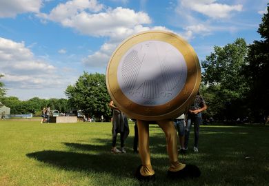 Person dressed as euro coin