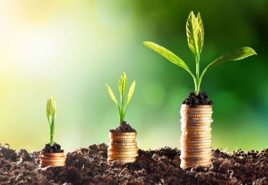 Coins growing in soil (economic growth)