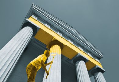 Man paints columns yellow