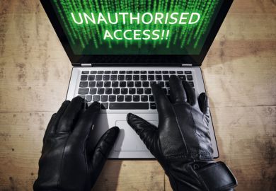 Computer cracker illegally accessing Apple MacBook laptop