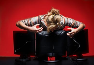 Woman leaning over computer