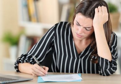 Concerned woman signs document Concerned woman signs document