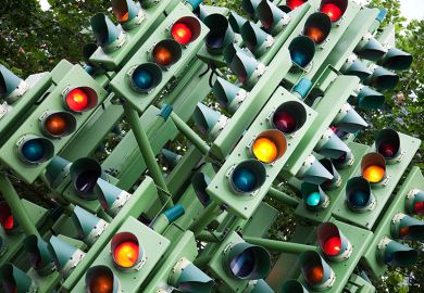 A sculpture made from traffic lights in East London. The lights which light red amber and green is in the shape of an abstract tree. To illustrate the need for a reset of how the OfS approaches watchdog duties and a rethink of England’s regulatory system.