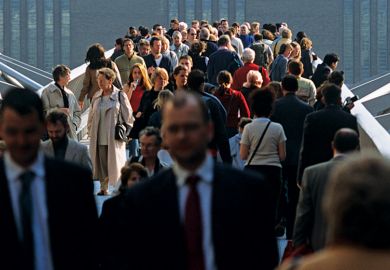 Crowd of people on Millennium Bridge, London