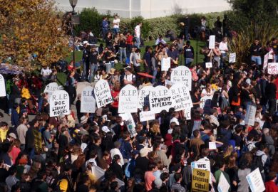 Crowd of protesters hold signs in front of Sproul Hall on UC Berkeley November 18, 2009 Crowd of protesters hold signs and rally tuition increases in front of Sproul Hall on UC Berkeley November 18 2009
