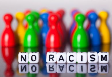 Cube letters show the words No Racism