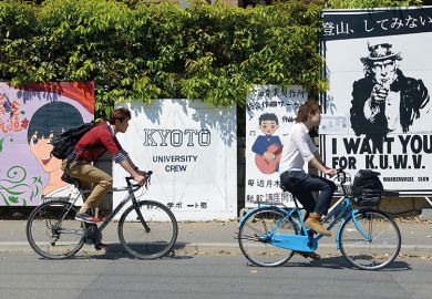 Two young men cycling in Japan