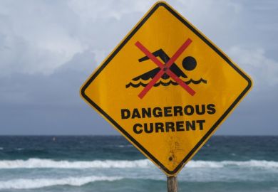 A sign in Australia reading "dangerous currents"