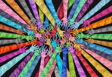 Multicololoured hands overlapping, symbolising DEI