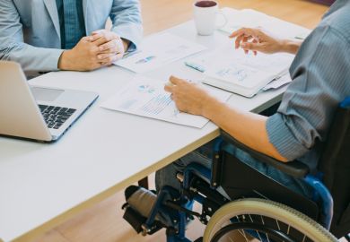 A person in a wheelchair at a job interview