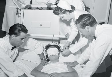 doctors administering electroshock therapy