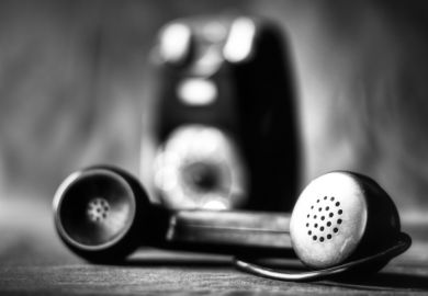 An old-fashioned phone in black and white An old-fashioned phone in black and white
