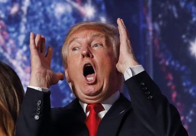 Donald Trump with his hands raised looking shocked
