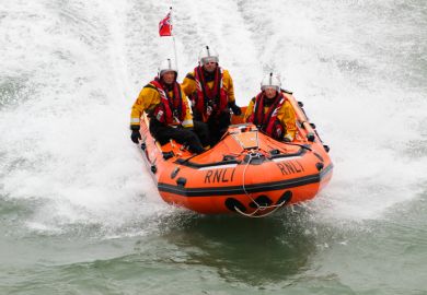 Eastbourne, UK - 17 August, 2013 Royal National Lifeboat Institution (RNLI) in-shore crew on duty at the Eastbourne Air Show on the English Channel, UK on 17 August, 2013.