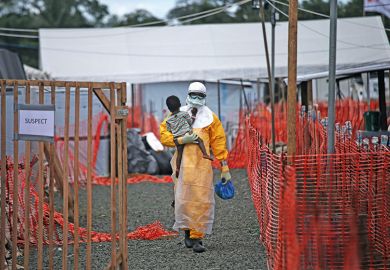Ebola doctor with child