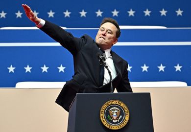 Tesla and SpaceX CEO Elon Musk gestures as he speaks during the inaugural parade inside Capitol One Arena, in Washington, DC, on 20 January 2025