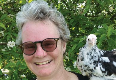 Author Emma Gee with a chicken on her shoulder