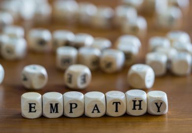 Dice spell out the word "empathy"