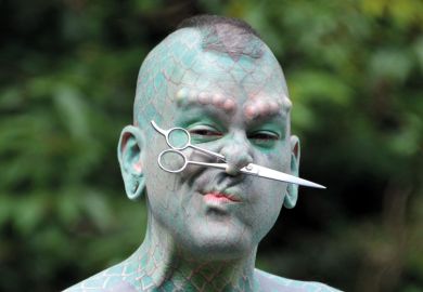 Erik Sprague (The Lizardman) with scissors through nose Erik Sprague (The Lizardman) with scissors through nose