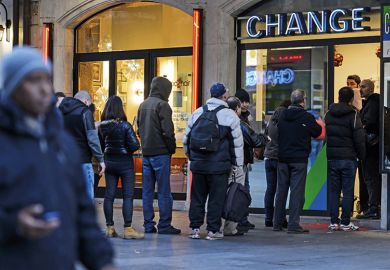 people queuing for currency at a bureau de change people queuing for currency at a bureau de change