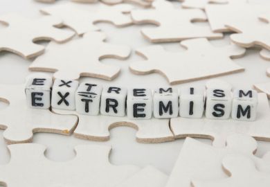 'Extremism' spelled in letter blocks