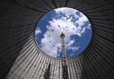 Visitors on a fairground ride rising into the sky from what was a nuclear fast breeder, at the amusement park in Kalkar, Germany, 2023. To illustrate German excellence strategies boosting the research capacity of its top institutions. Visitors on a fairground ride rising into the sky from what was a nuclear fast breeder, at the amusement park in Kalkar, Germany, 2023. To illustrate German excellence strategies boosting the research capacity of its top institutions.