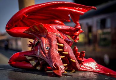 A fallen red Welsh dragon, illustrating whether the regulator Medr can find its teeth and reshape the Welsh university sector.