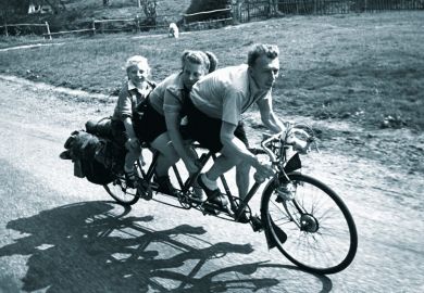Family riding three-seat bicycle Family riding three-seat bicycle