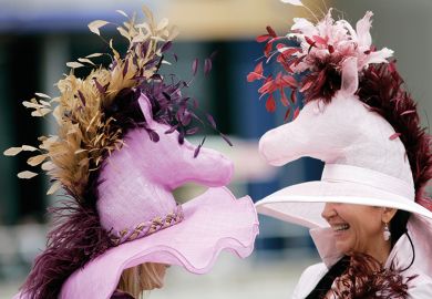 Two women wearing fancy hats Two women wearing fancy hats