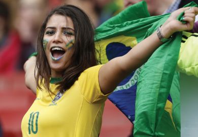 Female Brazilian football/soccer fan celebrating with flag of Brazil, Best universities in Latin America