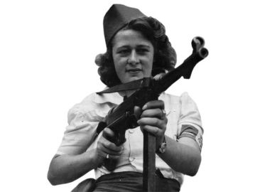 Female French Resistance fighter holding machine gun