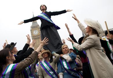 Feminists dressed as The Suffragettes at a protest for women's rights in London. One is standing on the others. To illustrate how a boycott of a feminist title failed to consider its likely impact on early career researchers Feminists dressed as The Suffragettes at a protest for women's rights in London. One is standing on the others. To illustrate how a boycott of a feminist title failed to consider its likely impact on early career researchers