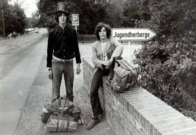 Two young men heading to a festival